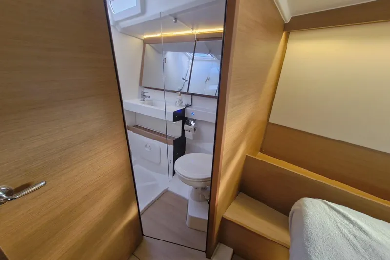 Dreamcatcher II Yacht Photos Pics Interior of 2019 Jeanneau Sun Odyssey 440 yacht bathroom with modern fixtures and wooden accents.