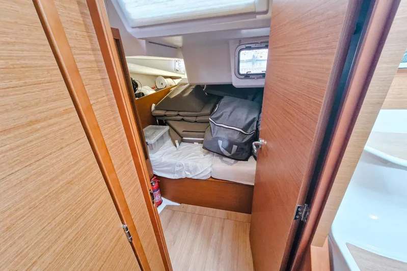 Dreamcatcher II Yacht Photos Pics Interior cabin of 2019 Jeanneau Sun Odyssey 440 yacht with storage items.