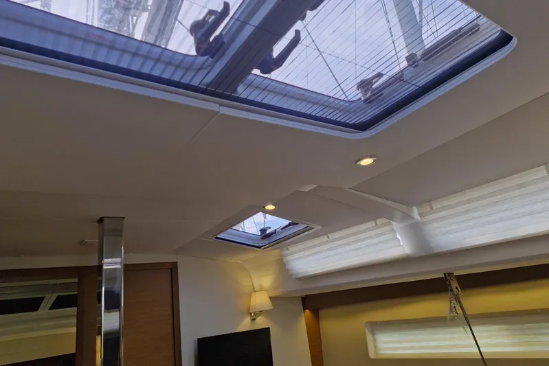 Dreamcatcher II Yacht Photos Pics Interior view of 2019 Jeanneau Sun Odyssey 440 yacht with skylights and modern lighting.