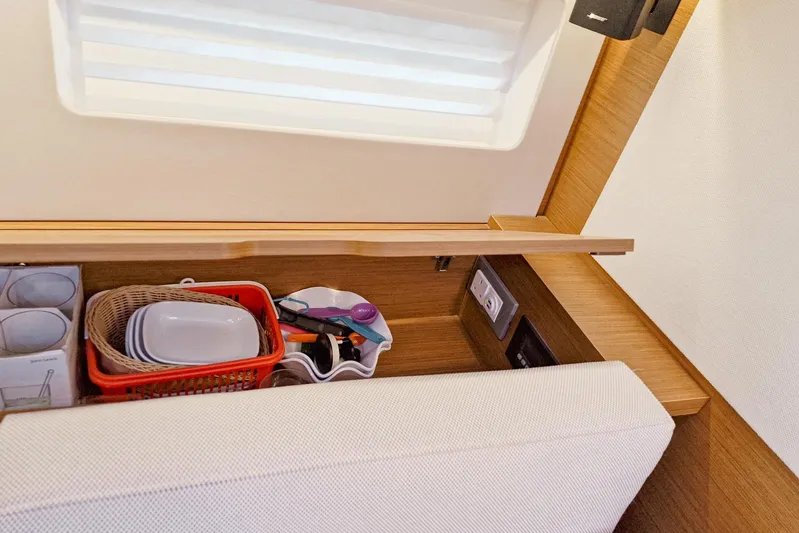Dreamcatcher II Yacht Photos Pics Interior storage area of 2019 Jeanneau Sun Odyssey 440 yacht with kitchenware.