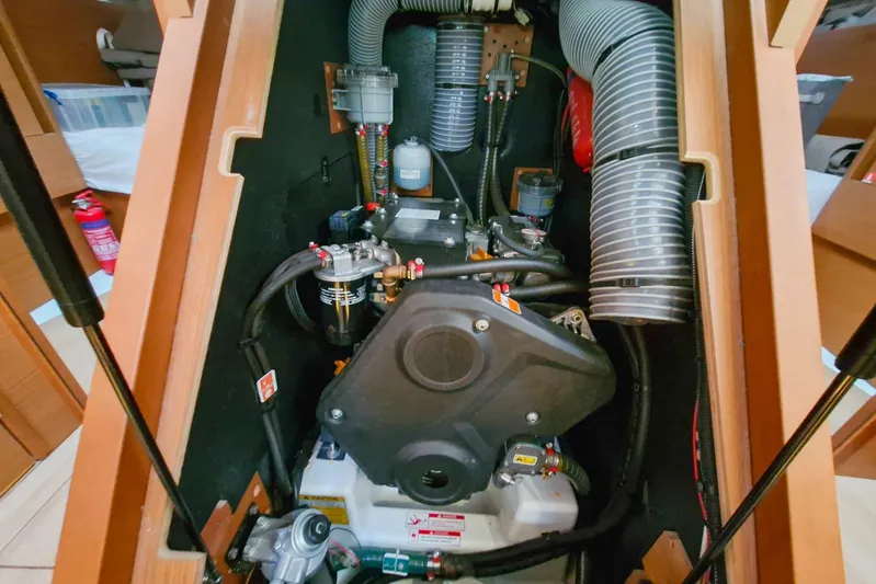 Dreamcatcher II Yacht Photos Pics Engine compartment of 2019 Jeanneau Sun Odyssey 440 sailboat, showcasing mechanical components.