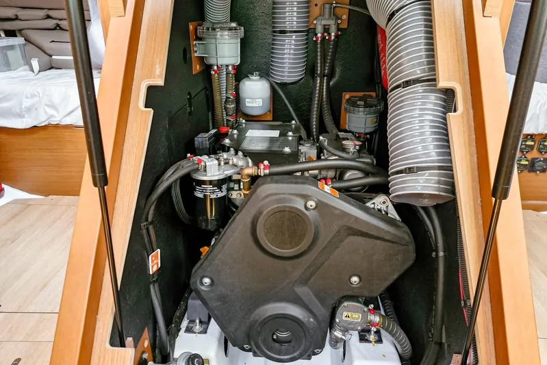 Dreamcatcher II Yacht Photos Pics Engine compartment of 2019 Jeanneau Sun Odyssey 440 sailboat, showcasing mechanical components.