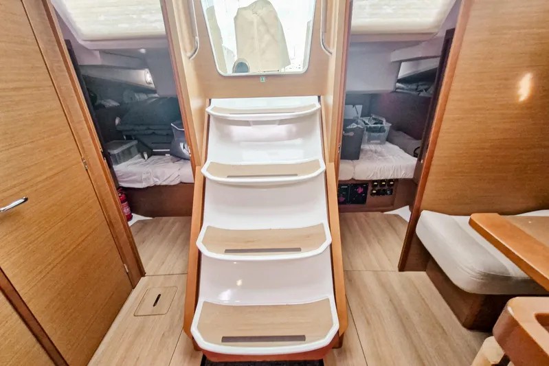 Dreamcatcher II Yacht Photos Pics Interior of 2019 Jeanneau Sun Odyssey 440 sailboat with wooden stairs and cozy cabins.