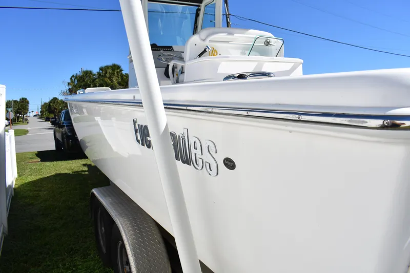  Yacht Photos Pics 2018 Everglades 273 Center Console boat parked on trailer, side view.