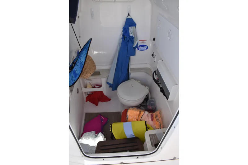  Yacht Photos Pics Interior of 2018 Everglades 273 Center Console boat with storage and toilet.