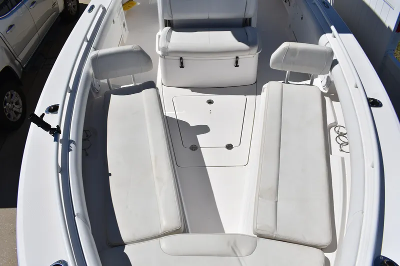  Yacht Photos Pics 2018 Everglades 273 Center Console boat interior with white seating and storage compartments.