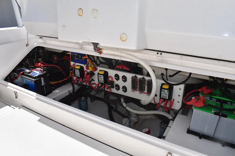  Yacht Photos Pics Electrical system of a 2018 Everglades 273 Center Console boat, showcasing wiring and batteries.