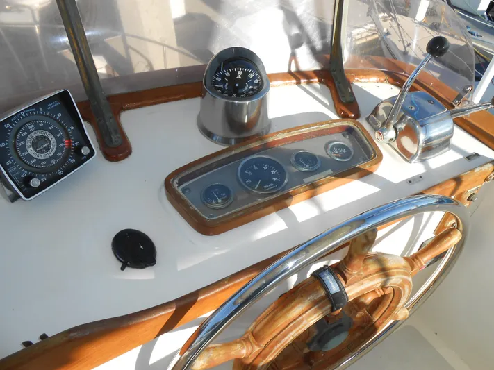 Ahoy Vey Yacht Photos Pics 1978 CHB 34 Aft Cabin helm with wooden wheel and navigation instruments.