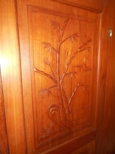 Ahoy Vey Yacht Photos Pics Intricate wood carving on 1978 CHB 34 Aft Cabin interior panel.