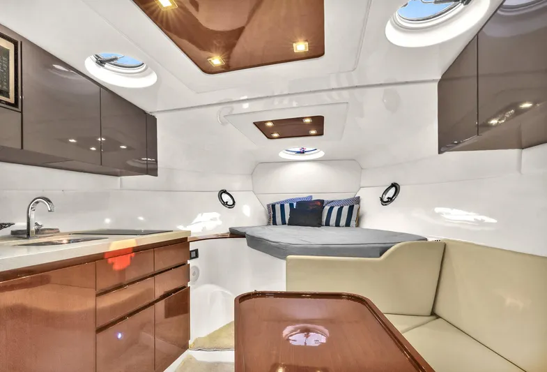 Dream Big Yacht Photos Pics Luxurious interior of 2023 Schaefer 375 yacht with modern kitchen and cozy sleeping area.