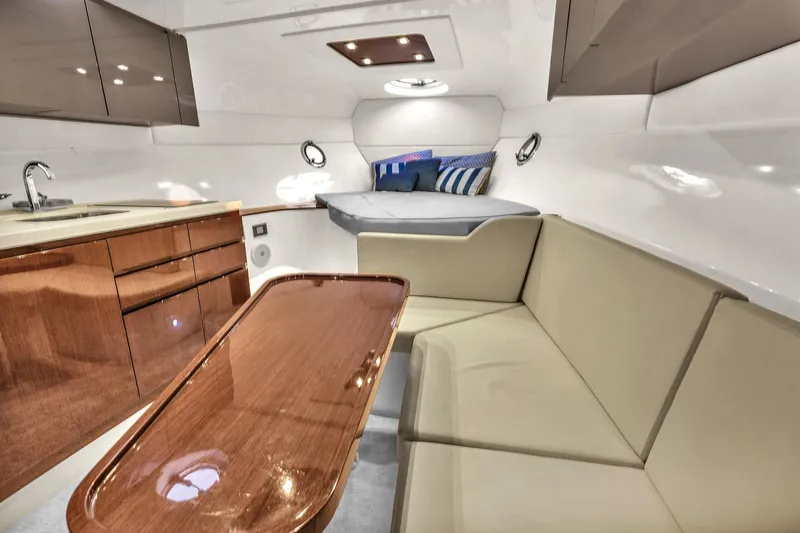 Dream Big Yacht Photos Pics Luxurious interior of 2023 Schaefer 375 yacht with modern seating and kitchenette.