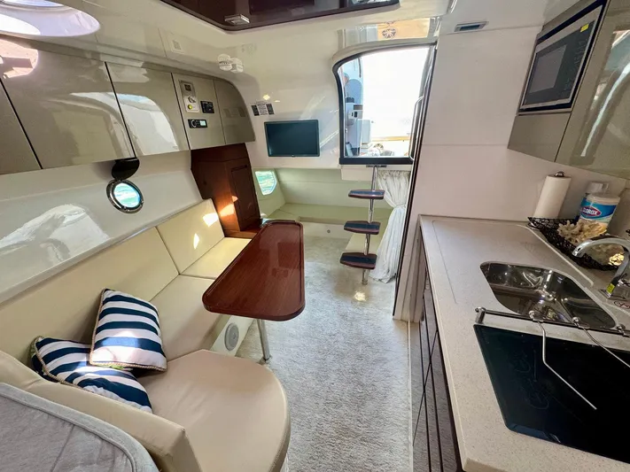 Dream Big Yacht Photos Pics Luxurious interior of 2023 Schaefer 375 yacht with modern kitchen and seating area.