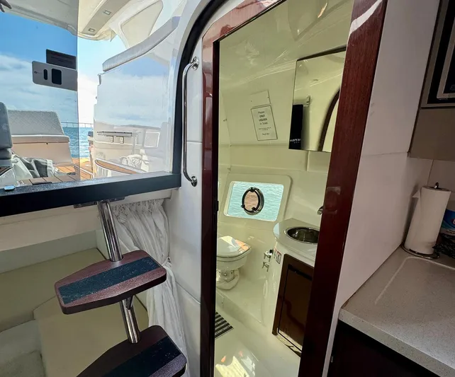 Dream Big Yacht Photos Pics Interior view of 2023 Schaefer 375 yacht, featuring a compact bathroom and modern design.