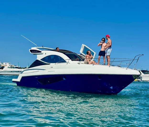 Dream Big Yacht Photos Pics 2023 Schaefer 375 yacht with people enjoying a sunny day on the water.