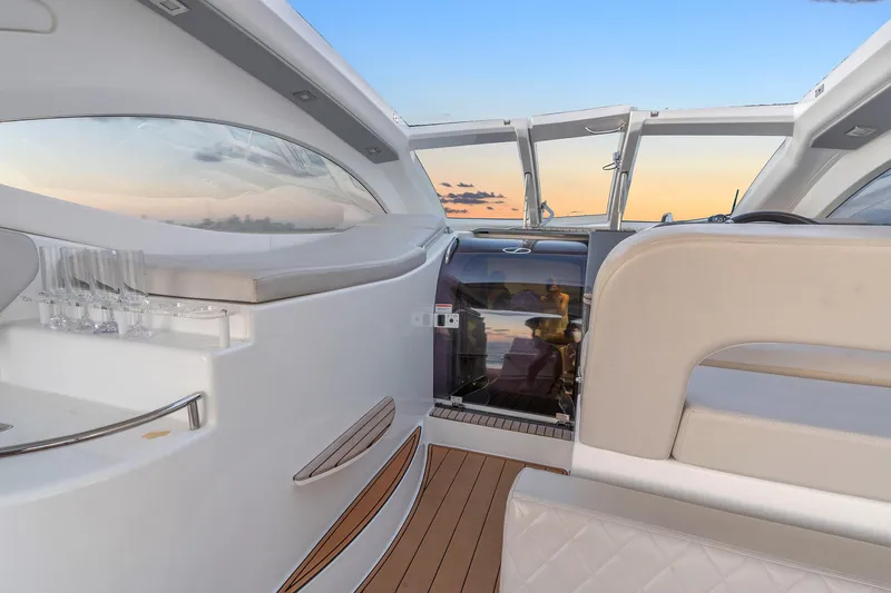 Dream Big Yacht Photos Pics Luxurious interior of 2023 Schaefer 375 yacht with sunset view through windows.