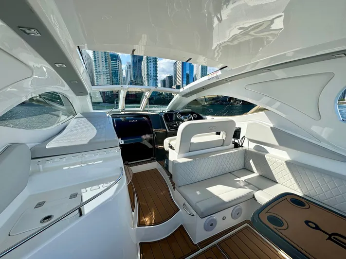 Dream Big Yacht Photos Pics Luxurious interior of 2023 Schaefer 375 yacht with modern design and city skyline view.