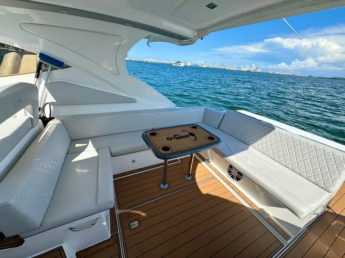 Dream Big Yacht Photos Pics Luxurious 2023 Schaefer 375 yacht interior with white seating and ocean view.