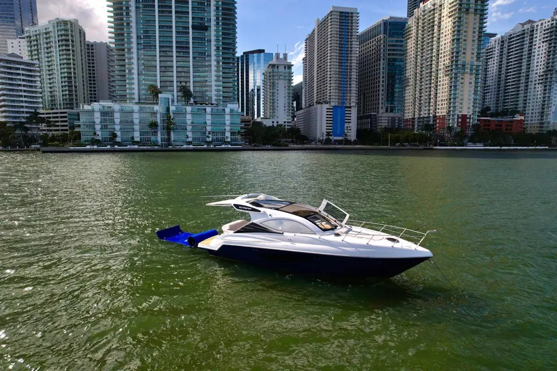 Dream Big Yacht Photos Pics 2023 Schaefer 375 yacht on water with city skyline backdrop.