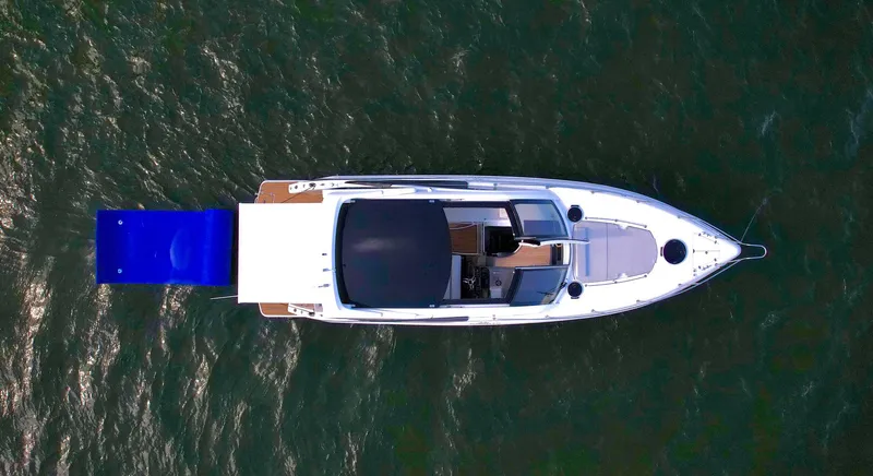 Dream Big Yacht Photos Pics Top view of 2023 Schaefer 375 yacht on water, featuring sleek design and spacious deck.