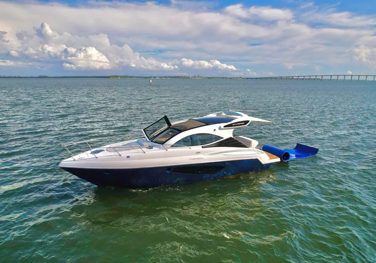 Dream Big Yacht Photos Pics 2023 Schaefer 375 yacht cruising on open water under a partly cloudy sky.