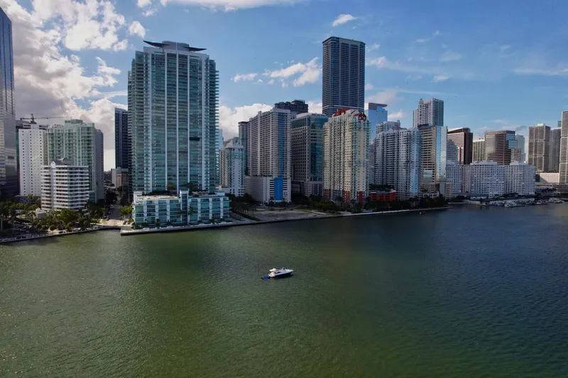 Dream Big Yacht Photos Pics Aerial view of a Schaefer 375 yacht on water with city skyline, 2023.