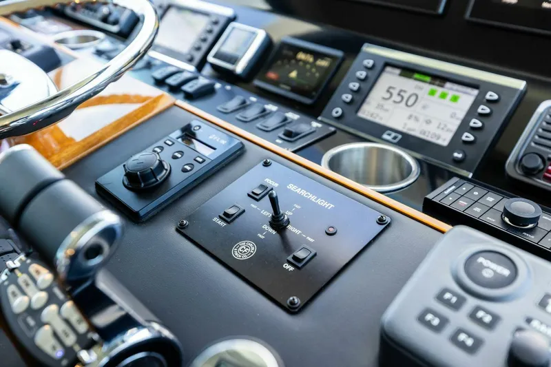 Backlash Yacht Photos Pics Control panel of 2023 Viking 72 Enclosed Bridge yacht with navigation instruments.