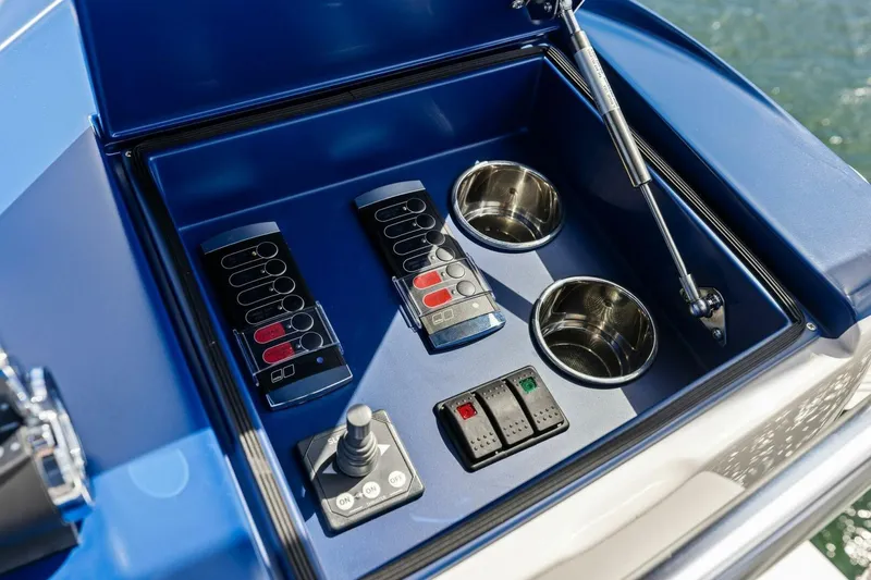Backlash Yacht Photos Pics Control panel of 2023 Viking 72 Enclosed Bridge yacht with switches and cup holders.