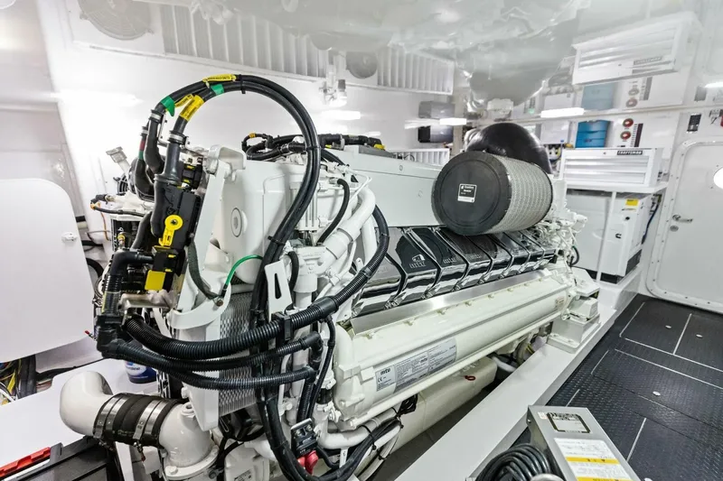 Backlash Yacht Photos Pics Engine room of 2023 Viking 72 Enclosed Bridge yacht, showcasing advanced machinery and equipment.