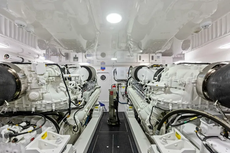 Backlash Yacht Photos Pics Engine room of 2023 Viking 72 Enclosed Bridge yacht, featuring dual powerful engines.