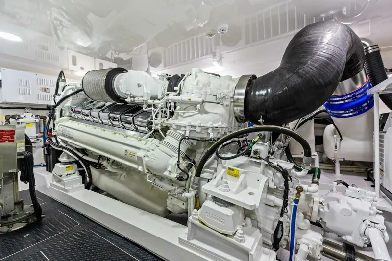 Backlash Yacht Photos Pics Engine room of 2023 Viking 72 Enclosed Bridge yacht, showcasing advanced machinery and components.