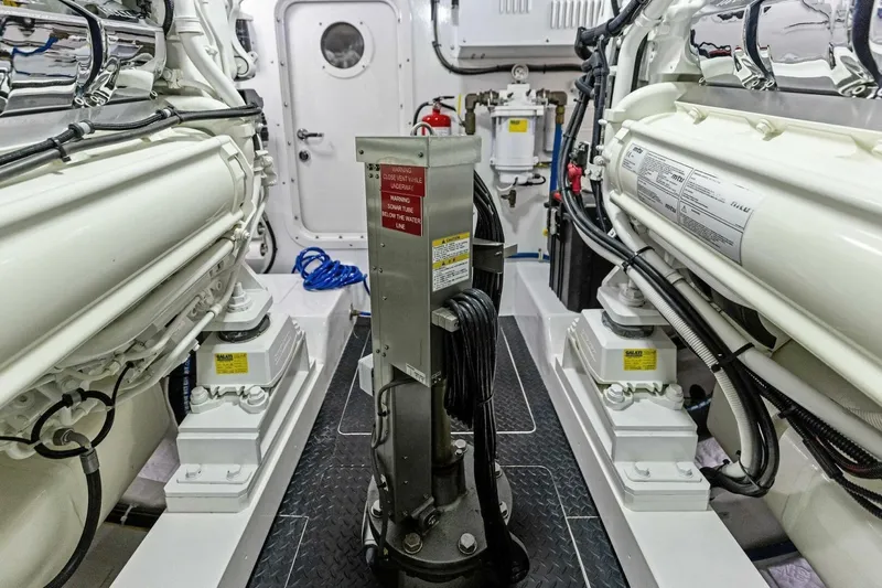 Backlash Yacht Photos Pics Engine room of 2023 Viking 72 Enclosed Bridge yacht, showcasing advanced machinery and equipment.