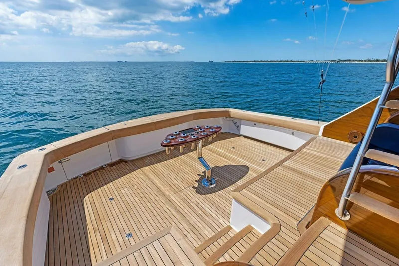 Backlash Yacht Photos Pics 2023 Viking 72 Enclosed Bridge yacht deck with ocean view.