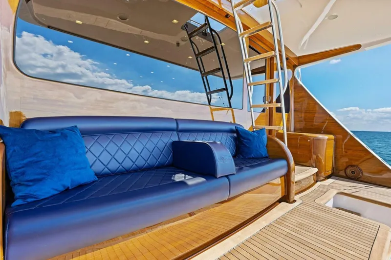 Backlash Yacht Photos Pics Luxurious seating on 2023 Viking 72 Enclosed Bridge yacht with ocean view.