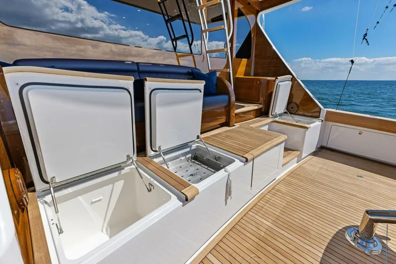 Backlash Yacht Photos Pics Luxurious 2023 Viking 72 Enclosed Bridge yacht deck with open storage compartments.