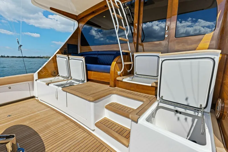 Backlash Yacht Photos Pics 2023 Viking 72 Enclosed Bridge yacht deck with open storage compartments and seating.