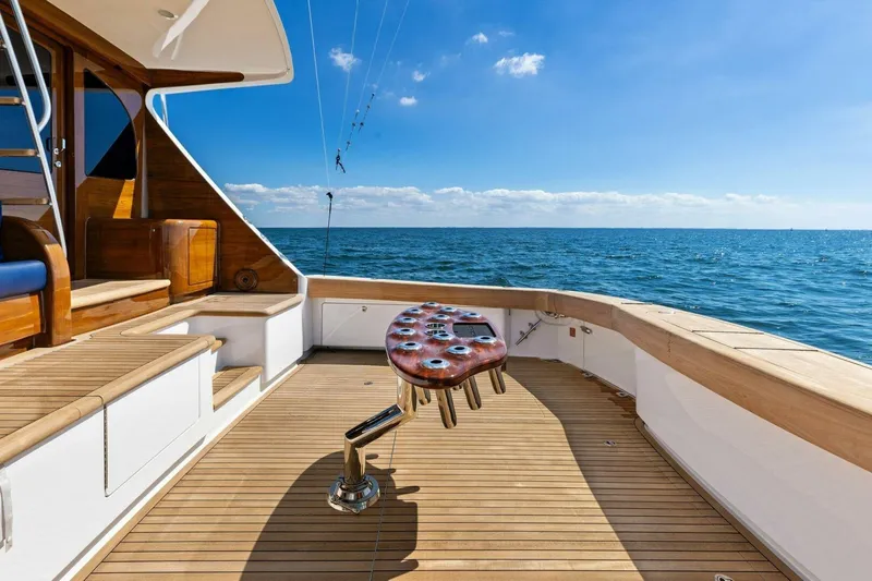 Backlash Yacht Photos Pics Luxurious 2023 Viking 72 Enclosed Bridge yacht deck with ocean view.