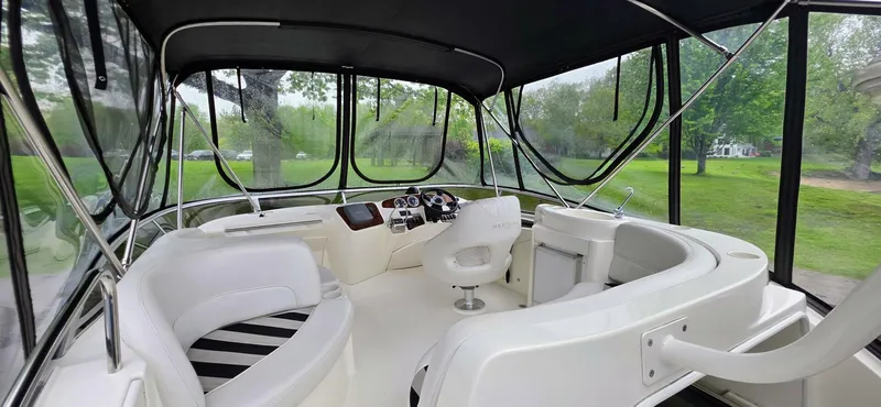  Yacht Photos Pics 2005 Meridian 368 Motor Yacht interior with white seating and panoramic windows.