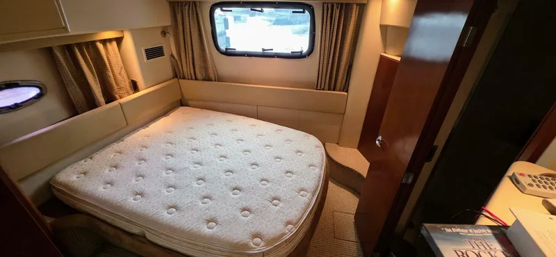  Yacht Photos Pics 2005 Meridian 368 Motor Yacht bedroom with window, bed, and cozy interior.