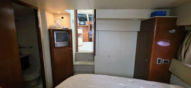  Yacht Photos Pics 2005 Meridian 368 Motor Yacht interior with TV, bed, and bathroom.
