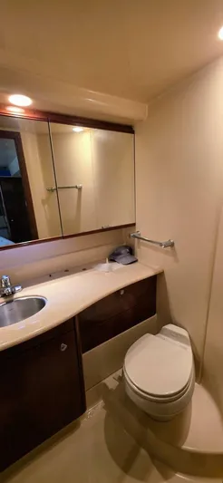  Yacht Photos Pics 2005 Meridian 368 Motor Yacht bathroom with sink, mirror, and toilet.