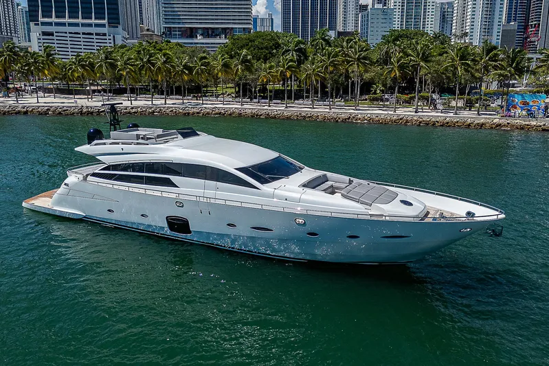Scissortail II Yacht Photos Pics Luxury 2013 Pershing 92 Express yacht cruising in a scenic waterfront setting.
