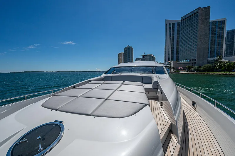 Scissortail II Yacht Photos Pics 2013 Pershing 92 Express yacht on water with city skyline in background.