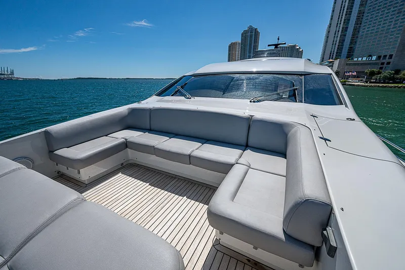 Scissortail II Yacht Photos Pics 2013 Pershing 92 Express yacht with spacious deck seating, ocean view, and city skyline.