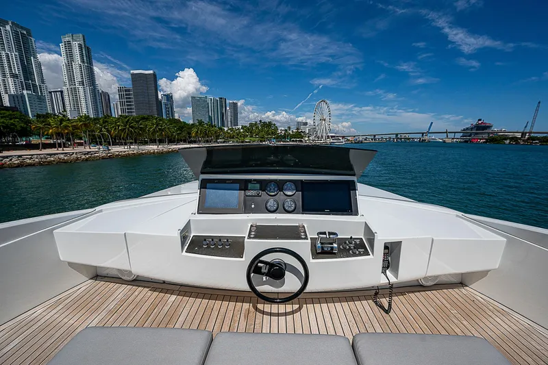 Scissortail II Yacht Photos Pics 2013 Pershing 92 Express yacht helm with city skyline and ocean view.
