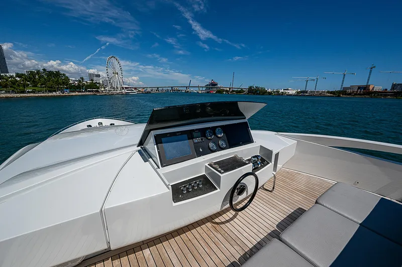 Scissortail II Yacht Photos Pics 2013 Pershing 92 Express yacht helm with scenic waterfront view.