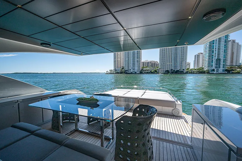 Scissortail II Yacht Photos Pics Luxurious 2013 Pershing 92 Express yacht with modern deck and stunning waterfront city view.