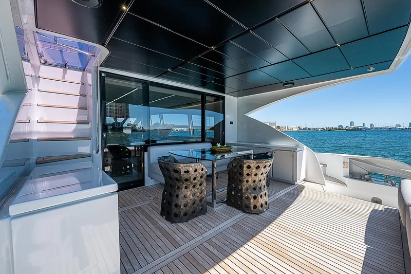 Scissortail II Yacht Photos Pics Luxurious 2013 Pershing 92 Express yacht deck with modern seating and ocean view.