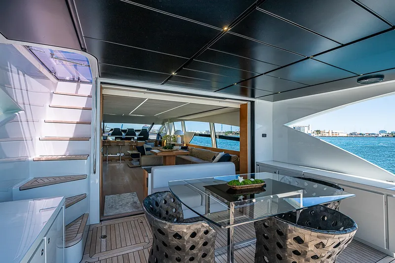 Scissortail II Yacht Photos Pics Luxurious 2013 Pershing 92 Express yacht interior with elegant seating and ocean view.