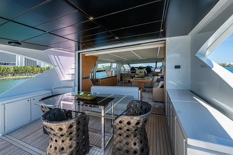 Scissortail II Yacht Photos Pics Luxurious 2013 Pershing 92 Express yacht interior with modern dining area and scenic views.