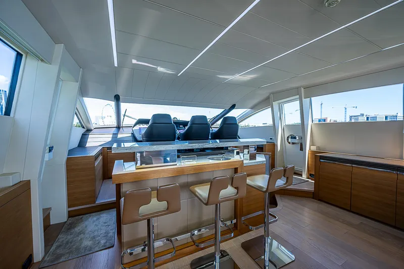 Scissortail II Yacht Photos Pics Luxurious interior of 2013 Pershing 92 Express yacht with modern seating and sleek design.